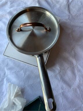 Stainless Steel Saucepan Copper-Tone Handle Silver Wolfgang
Puck brand 1.5 quart